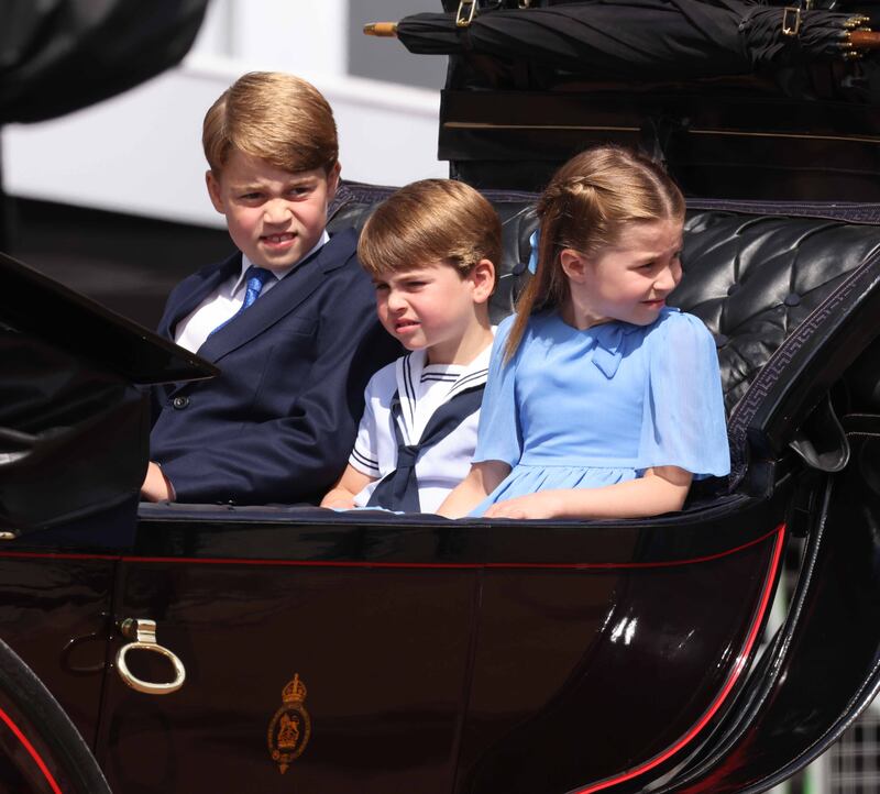(L-R) Prince George of Cambridge, Prince Louis of Cambridge and Princess Charlotte of Cambridge travel in a horse-drawn carriage during Trooping The Colour. Getty