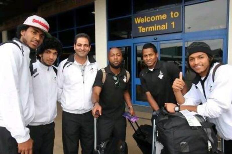 Ismail Matar, centre, and other members of the UAE Olympic football team arrived at Manchester Airport.