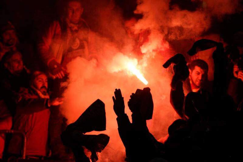 Galatasaray supporters celebrate winning 3-2 in the Champions League round of 16 second leg soccer match between Schalke and  Galatasaray in Gelsenkirchen, Germany, Tuesday, March 12, 2013. (AP Photo/Frank Augstein)  *** Local Caption ***  Germany Soccer Champions League.JPEG-0ea98.jpg