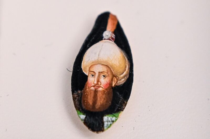A portrait painted on a pumpkin seed by Turkey's micro artist Hasan Kale.