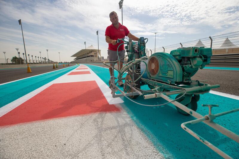 A fresh coat of Yas Blue is laid down across the circuit. Courtesy Yas Marina Circuit