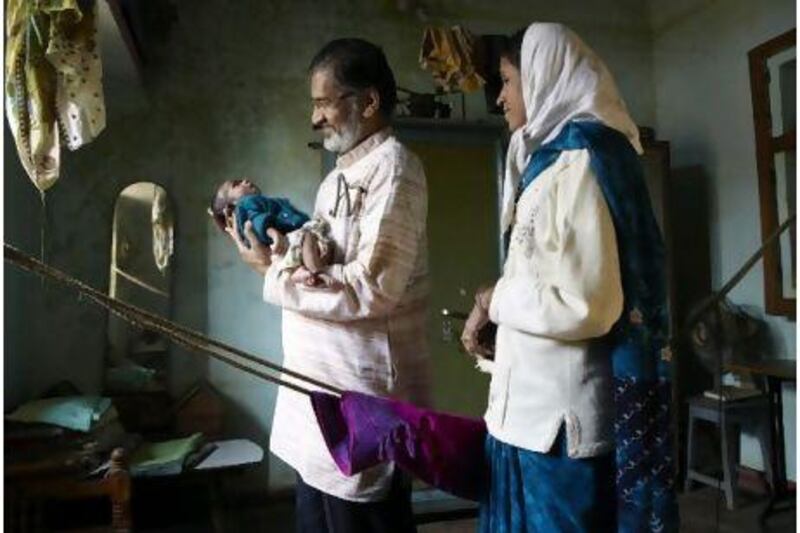Dr Bang visits Meena Dhit and her newborn baby in her home for health checks. Dr Bang has created teams of health workers known as arogyadoots, for home-based neonatal care, that have dramatically reduced infant mortality rates in rural India's villages such as Bodli, in Maharashtra. Andy Hall