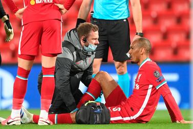 Liverpool's Fabinho receives medical treatment during the Champions League match against Midtjylland at Anfield. EPA