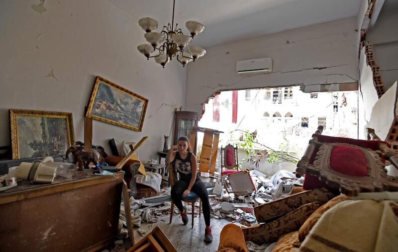 -- AFP PICTURES OF THE YEAR 2020 --

A woman sits amidst the rubble in her damaged house in the Lebanese capital Beirut on August 6, 2020, two days after a massive explosion shook the Lebanese capital.  The blast, which appeared to have been caused by a fire igniting 2,750 tonnes of ammonium nitrate left unsecured in a warehouse, was felt as far away as Cyprus, some 150 miles (240 kilometres) to the northwest. The scale of the destruction was such that the Lebanese capital resembled the scene of an earthquake, with thousands of people left homeless and thousands more cramming into overwhelmed hospitals for treatment. - 
 / AFP / -
