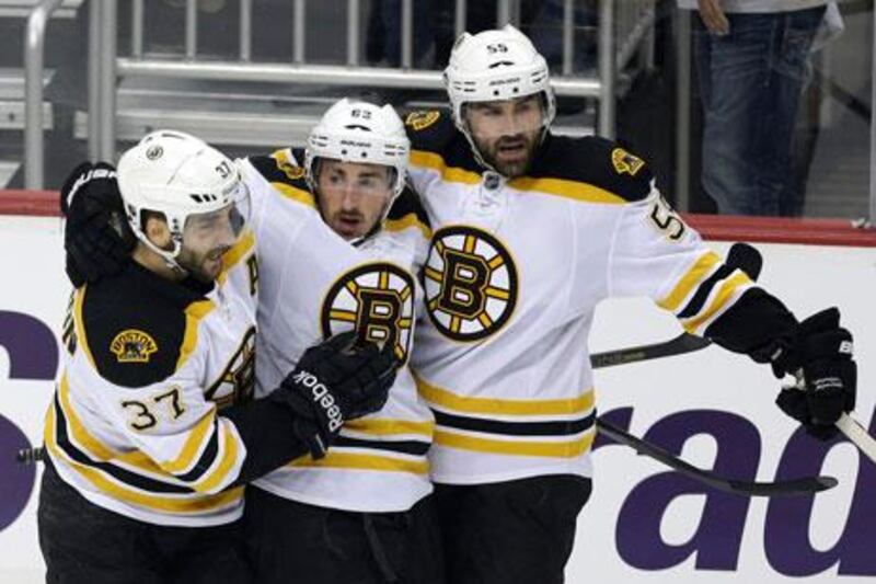 Brad Marchand, centre, was a hero for the Boston Bruins in Game 2. Gene J Puskar / AP Photo