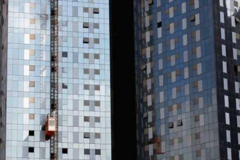 DUBAI, UNITED ARAB EMIRATES - DECEMBER 03:  A lift operates on a nearly completed residential high rise apartment on December 3, 2009 in Dubai, United Arab Emirates. Stock markets in the Dubai and Abu Dhabi fell sharply this week after state owned company Dubai World asked for more time to pay off depts, amounting to 35Bn GBP. The Dubai economy which has enjoyed years of rapid growth has seen a sharp decline recently as world markets reacted to the global economic crisis.  (Photo by Dan Kitwood/Getty Images) *** Local Caption ***  GYI0059059166.jpg