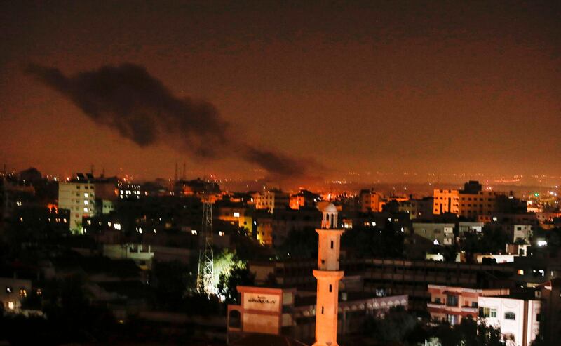 Smoke and flames are seen following an Israeli air strike in Gaza city. AFP