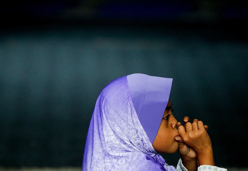 A Rohingya child at study. Daniel Chan  / AP Photo