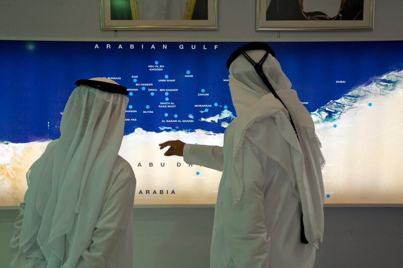 United Arab Emmirates - Abu Dhabi - Nov. 5 - 2008 : Two men look  an Arabian Gulf map inside the ADNOC & its Group of Companies showroom in ADIPEC 2008 , Abu Dhabi International Petroleum Exhibition & Conference at Abu Dhabi National Exhibition Centre. ( Jaime Puebla / The National ) *** Local Caption ***  JP08 - ADIPEC.jpgbz09no-sectoradnoc1.jpg