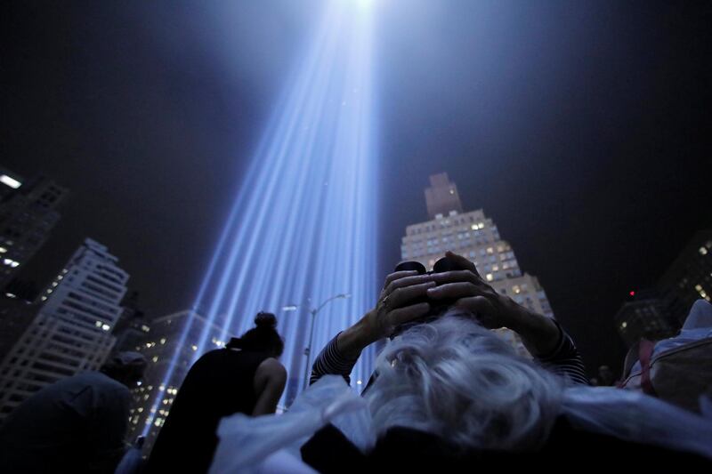 Members of the New York City Audubon Society monitor birds attracted to the Tribute in Light installation. Reuters