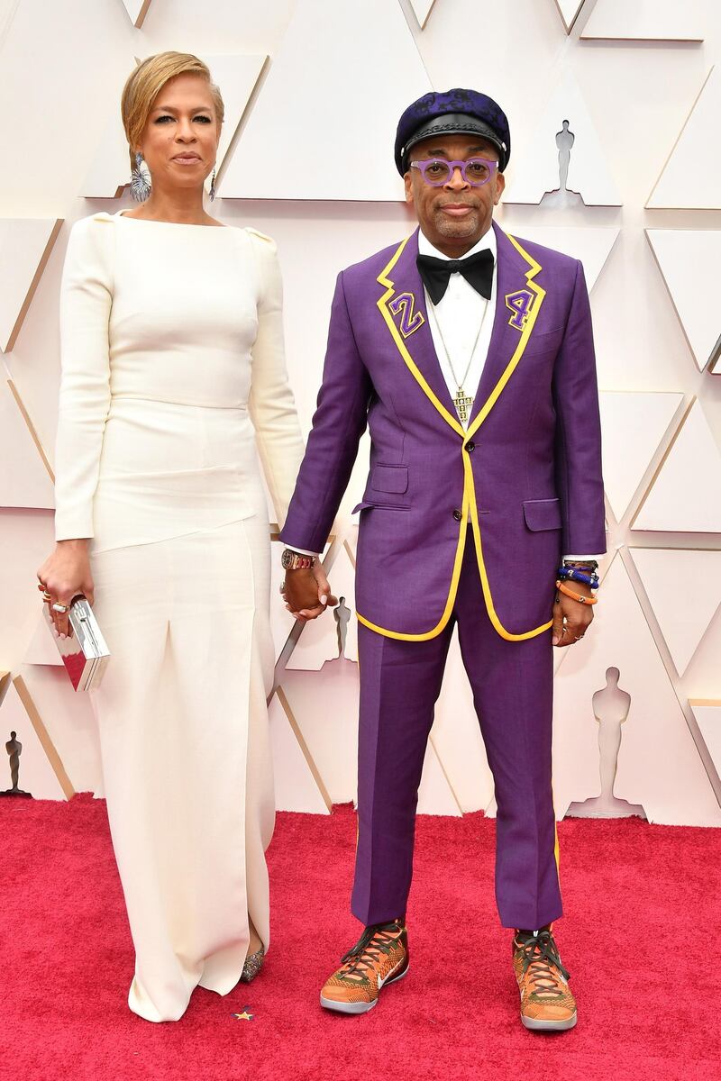 Tonya Lewis Lee and Spike Lee, wearing Gucci in a tribute to Kobe Bryant, arrive at the Oscars on Sunday, February 9, 2020, at the Dolby Theatre in Los Angeles. AP