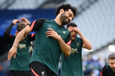 Liverpool's Egyptian midfielder Mohamed Salah reacts during a training session at the Stade de France stadium in Saint-Denis, Paris on May 27, 2022, on the eve of their UEFA Champions League final football match against Real Madrid.  (Photo by FRANCK FIFE  /  AFP)