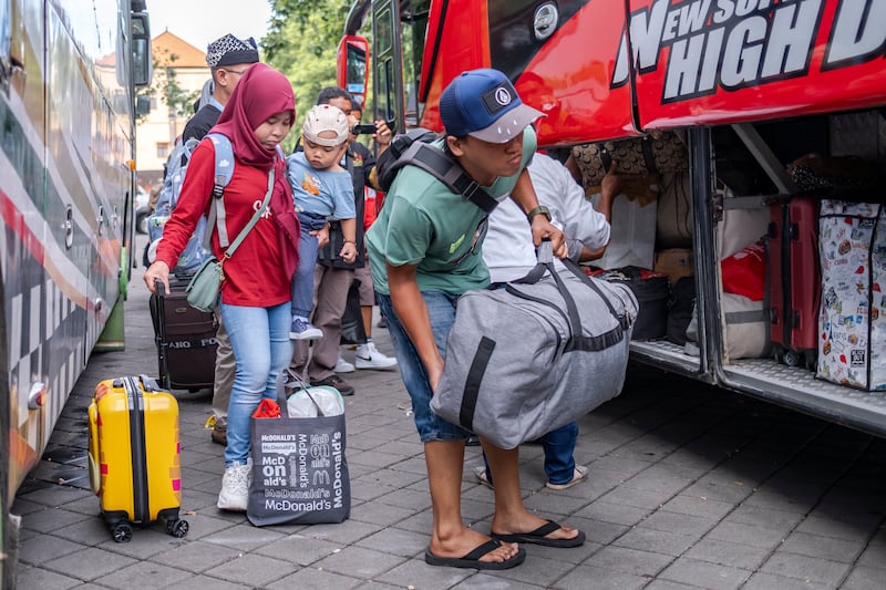 An Indonesian family prepare for their journey home for Eid Al Fitr in Denpasar, the provincial capital of Bali EPA