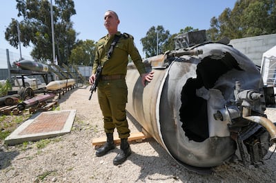 Israeli military spokesman Rear Adm Daniel Hagari shows an Iranian ballistic missile Israel intercepted over the weekend. AP