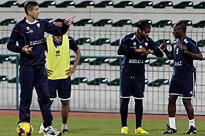 Srecko Katanec, left, the UAE manager, directs a team training session.