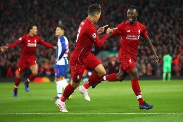 Naby Keita celebrates scoring Liverpool's first goal past Porto's Iker Casillas at Liverpool on Tuesday night. Julian Finney / Getty Images