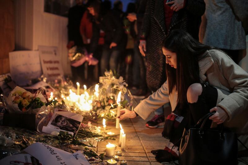 Moroccans lay flowers and messages during a candlelight vigil outside the Norwegian embassy in Rabat for two Scandinavian university students who were killed in a terrorist attack in a remote area of the Atlas Mountains, Morocco, Saturday, Dec. 22, 2018. Moroccans gathered Saturday in front of the Norwegian and Danish embassies in Rabat in a candlelight vigil to honor two Scandinavian university students killed in a terrorist attack in the Atlas Mountains. (AP Photo/Mosa'ab Elshamy)