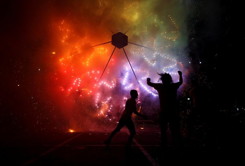 Revellers enjoy a fireworks display during week-long celebrations marking the feast of the Assumption of Our Lady in Mosta, Malta. Darrin Zammit Lupi / Reuters