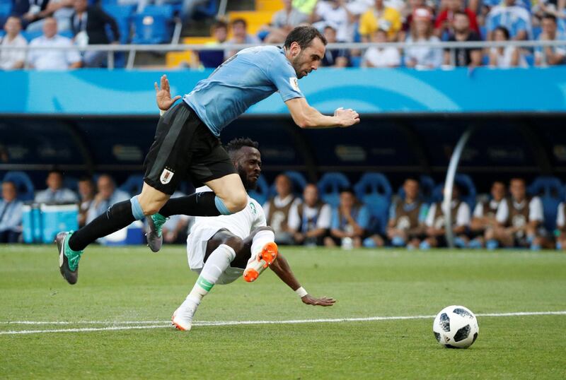 Uruguay's Diego Godin in action with Saudi Arabia's Fahad Al-Muwallad. Max Rossi / Reuters