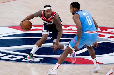 epa09015278 Washington Wizards guard Bradley Beal dribbles beside Houston Rockets guard Sterling Brown (R) during the NBA basketball game between the Houston Rockets and the Washington Wizards at Capital One Arena in Washington, DC, USA, 15 February 2021.  EPA/MICHAEL REYNOLDS SHUTTERSTOCK OUT