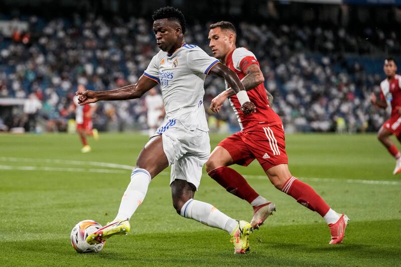 Real Madrid's Vinicius Junior, left, vies for the ball. AP Photo