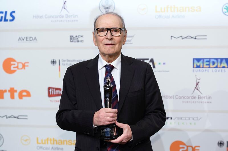 BERLIN, GERMANY - DECEMBER 07:  Ennio Morricone poses with his award for european film music at the European Film Awards 2013 on December 7, 2013 in Berlin, Germany.  (Photo by Clemens Bilan/Getty Images)