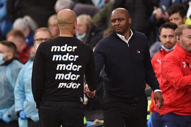 Crystal Palace's French manager Patrick Vieira (centre right) shakes hands with Manchester City's Spanish manager Pep Guardiola after the English Premier League football match between Manchester City and Crystal Palace at the Etihad Stadium in Manchester, north west England, on October 30, 2021.  - Crystal Palace won the game 2-0.  (Photo by Oli SCARFF / AFP) / RESTRICTED TO EDITORIAL USE.  No use with unauthorized audio, video, data, fixture lists, club/league logos or 'live' services.  Online in-match use limited to 120 images.  An additional 40 images may be used in extra time.  No video emulation.  Social media in-match use limited to 120 images.  An additional 40 images may be used in extra time.  No use in betting publications, games or single club/league/player publications.   /  