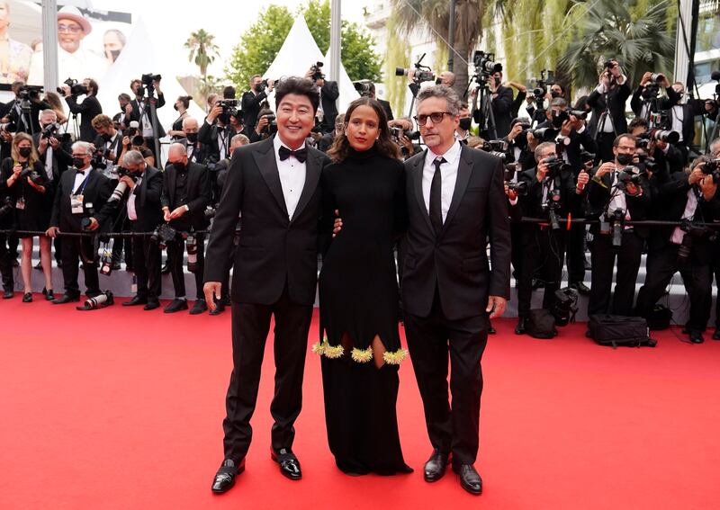 Song Kang-ho, Mati Diop and Kleber Mendonca Filho attend the screening of 'The French Dispatch' at the 74th annual Cannes Film Festival on July 12, 2021