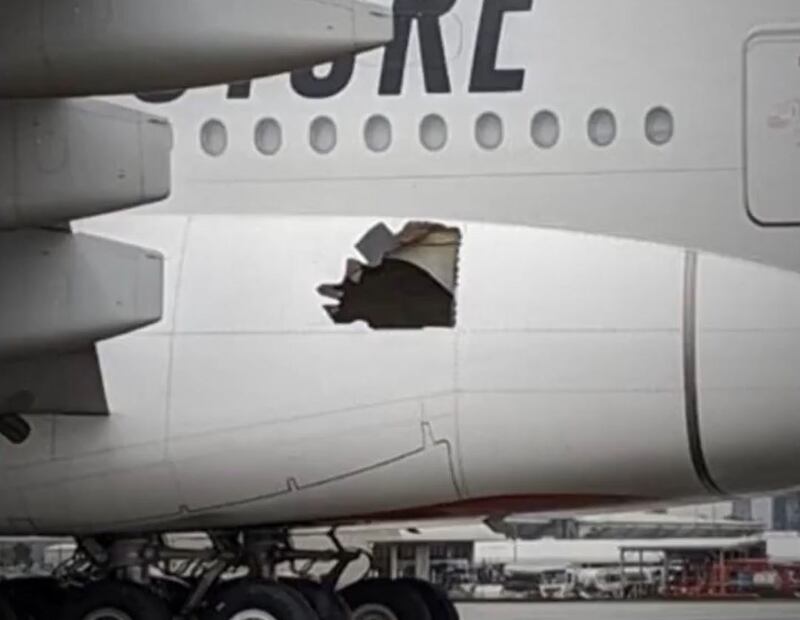 This footage aired by Australian media shows a hole in the plane's fuselage after a tyre burst. Photo: 7NewsBrisbane
