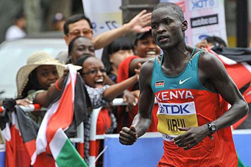 Abel Kirui is cheered on by Kenyan compatirots during his successful defence of the marathon title at the world athletics championships in Daegu, South Korea.