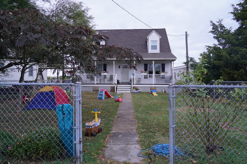 Children's toys fill the front lawn of a house on Tangier Island. The island's population has been steadily decreasing for years. 