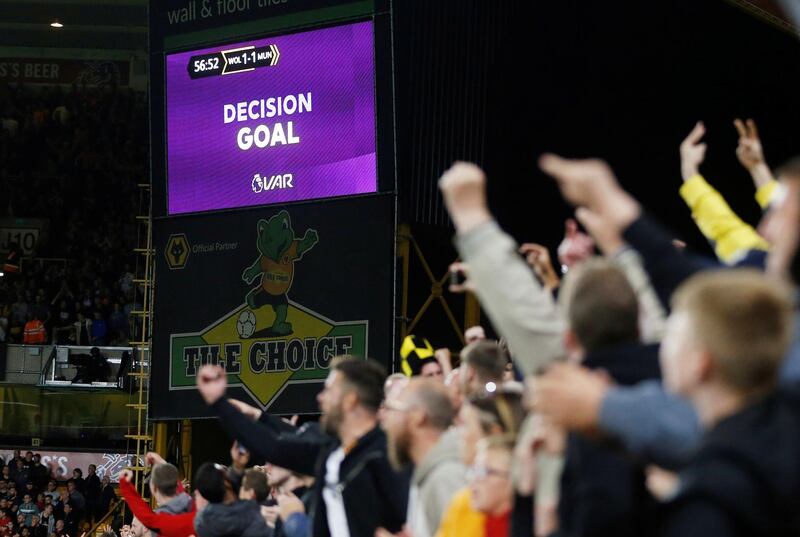 The big screen at Molineux displays a VAR review message after Wolverhampton Wanderers' Ruben Neves scores their first goal. Reuters