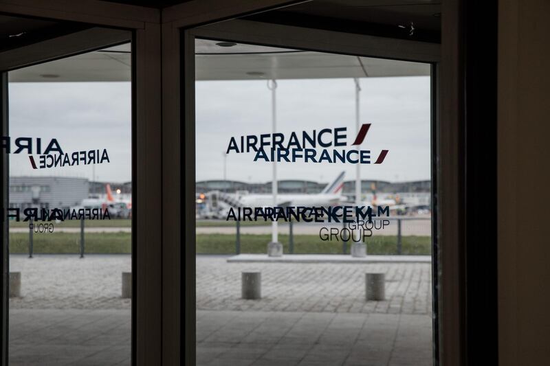 The Air France-KLM Group logo sits on revolving doors at airline's headquarters in Roissy, France, on Thursday, Feb. 20. 2020. Air France-KLM warned the coronavirus outbreak will wipe as much as 200 million euros ($216 million) from earnings, hammering home the financial impact of the crisis even thousands of miles from its epicenter in China. Photographer: Marlene Awaad/Bloomberg