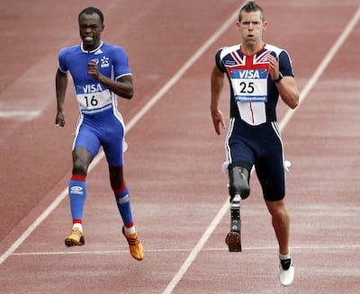 John McFall and Clavel Kayitare of France competing in the men's 200m at the Paralympic World Cup in 2007. AFP