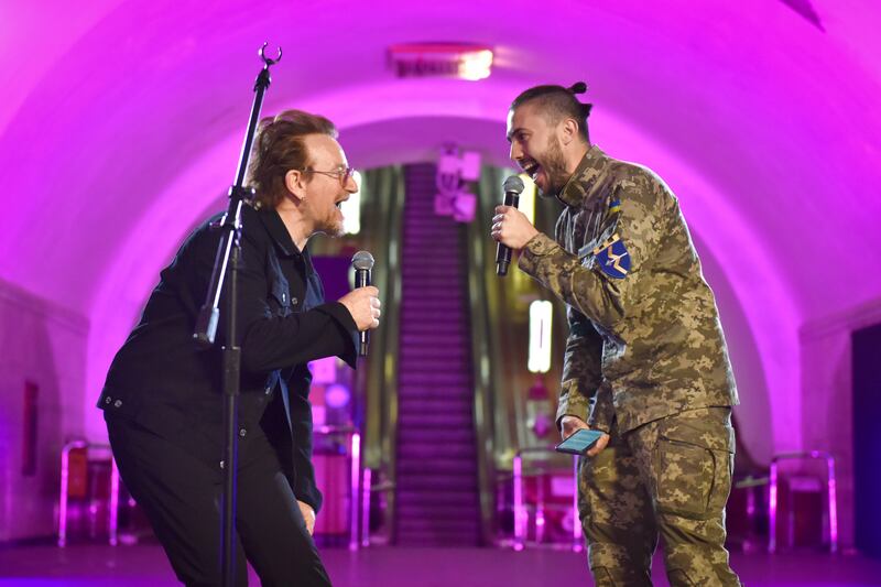 Bono performs with Ukrainian singer Taras Topolya, of the band Antytila, who now serves in the Ukrainian army. EPA