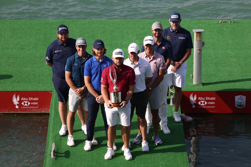 From left: Shane Lowry of Ireland, Viktor Hovland of Norway, Tommy Fleetwood of England, Tyrrell Hatton of England, Rory McIlroy of Northern Ireland, Collin Morikawa of the USA, Adam Scott of Australia and Lee Westwood of England pose for a photo during a practice round prior to the Abu Dhabi HSBC Championship at Yas Links Golf Course. Getty Images