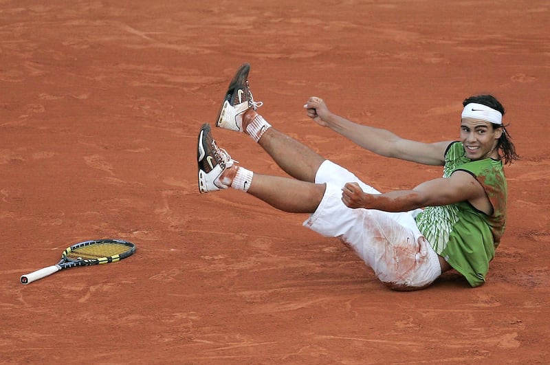PARIS - JUNE 3:  Rafael Nadal of Spain celebrates match point as he defeats Roger Federer of Switzerland in four sets during their semi-final match on the twelfth day of the French Open at Roland Garros on June 3, 2005 in Paris, France.  (Photo by Clive Mason/Getty Images)