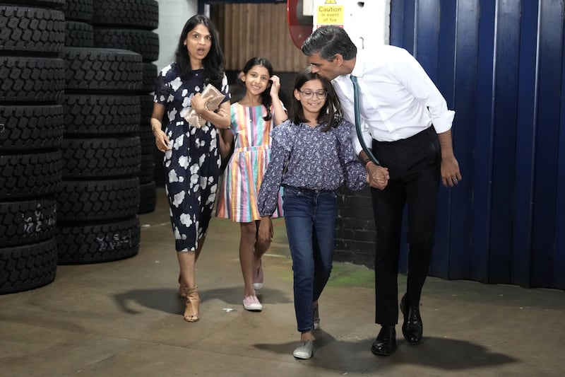 With daughters Krisna and Anoushka and wife Akshata Murthy. Getty