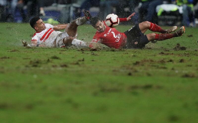 Ahly's Ayman Ashraf in action with El Zamalek's Youssef Obama at the Borg El Arab Stadium in Alexandria on March 30, 2019. Reuters