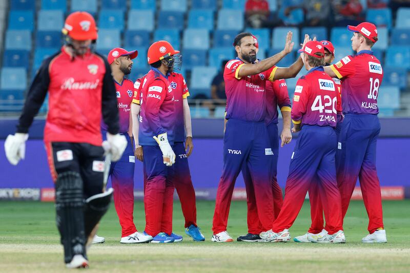 Dubai Capitals' Yusuf Pathan celebrates the wicket of Colin Munro of Desert Vipers.