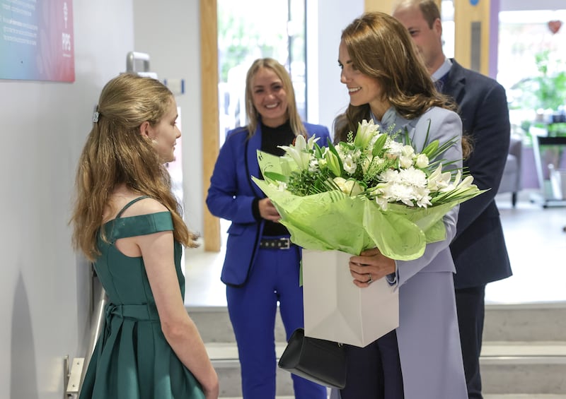 The Princess of Wales receives flowers during her visit to the PIPS. EPA