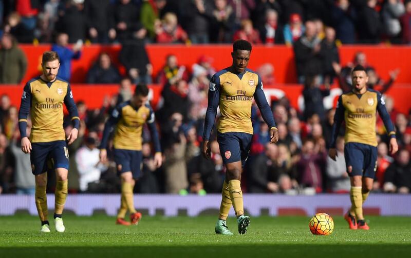 Danny Welbeck of Arsenal looks dejected with team mates during the Barclays Premier League match between Manchester United and Arsenal at Old Trafford on February 28, 2016 in Manchester, England. (Photo by Shaun Botterill/Getty Images)
