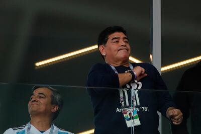 Former soccer star Diego Maradona pounds his chest during the group D match between Argentina and Iceland at the 2018 soccer World Cup in the Spartak Stadium in Moscow, Russia, Saturday, June 16, 2018. (AP Photo/Ricardo Mazalan)