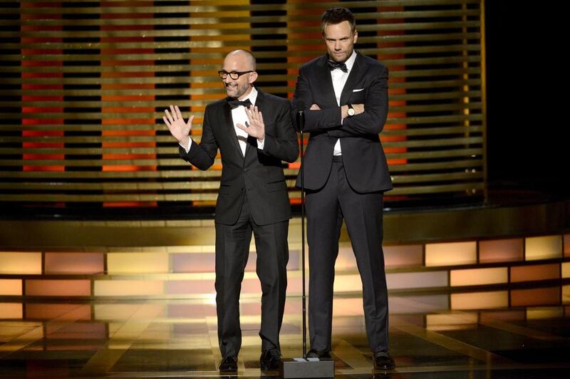Jim Rash, left, and Joel McHale speak on stage at the Television Academy’s Creative Arts Emmy Awards at the Nokia Theater L.A. LIVE on Saturday, Aug. 16, 2014, in Los Angeles. Phil McCarten / Invision for the Television Academy / AP Images
