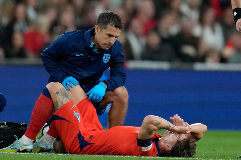 England's John Stones lies on the pitch injured and had to be replaced in the first half. AP