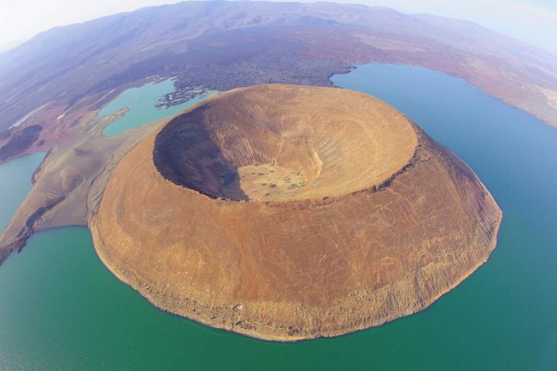 Lake Turkana is situatated in the Great Rift Valley in Kenya. It is the world?s largest desert lake and the world?s largest alkaline lake. Rocks in the surrounding area are predominantly volcanic. Image not manipulated