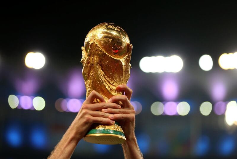 File photo dated 13-07-2014 of A Germany player lifts the FIFA World Cup Trophy PRESS ASSOCIATION Photo. Issue date: Wednesday May 22, 2019. The 2022 World Cup in Qatar will take place with 32 teams, FIFA has announced. See PA story SOCCER FIFA. Photo credit should read Mike Egerton/PA Wire.