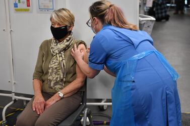 Rita Passey receives an injection of a Covid-19 vaccine at the NHS vaccine centre that has been set up at the Millennium Point centre in Birmingham, Britain. EPA