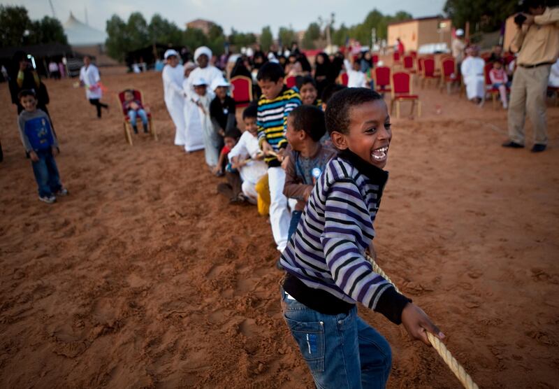 Al Ain, United Arab Emirates, January 30, 2013: 
Led by 9-year-old Fahad Hamed (R), children try their hand and strength in rope pulling as they partake in a Family Day organized for the employees and the foster families of Dar Zayed for Family Care, a state-funded  programme in Al Ain for abandoned, orphaned or neglected children, on Wednesday evening, Jan. 30, 2013, at the Al Bedaa Resort near Al Ain where the organization is based. The children attending Family Day were a mixture of staff children, children who live in Dar Zayed villas and children placed long-term with outside foster families. It is the second time Dar Zayed has held the Family Day event.
Silvia Razgova / The National
