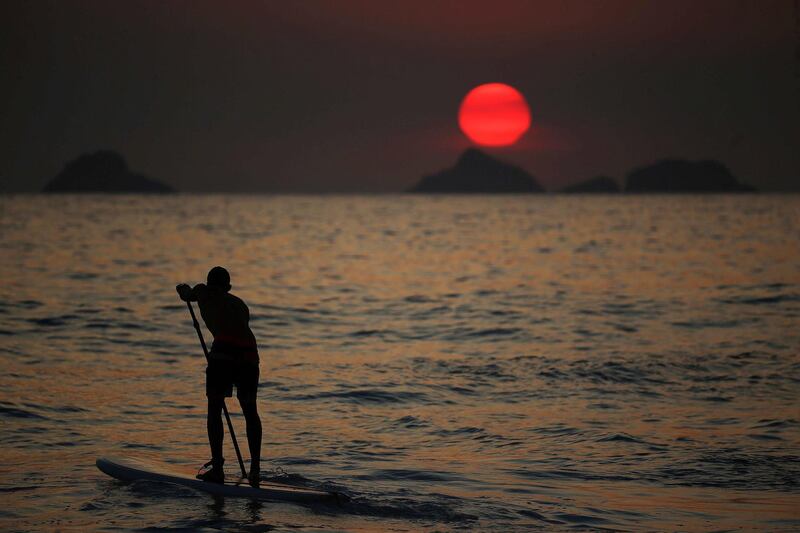 A man practices paddleboarding at Ipanema beach in Rio de Janeiro, Brazil. EPA